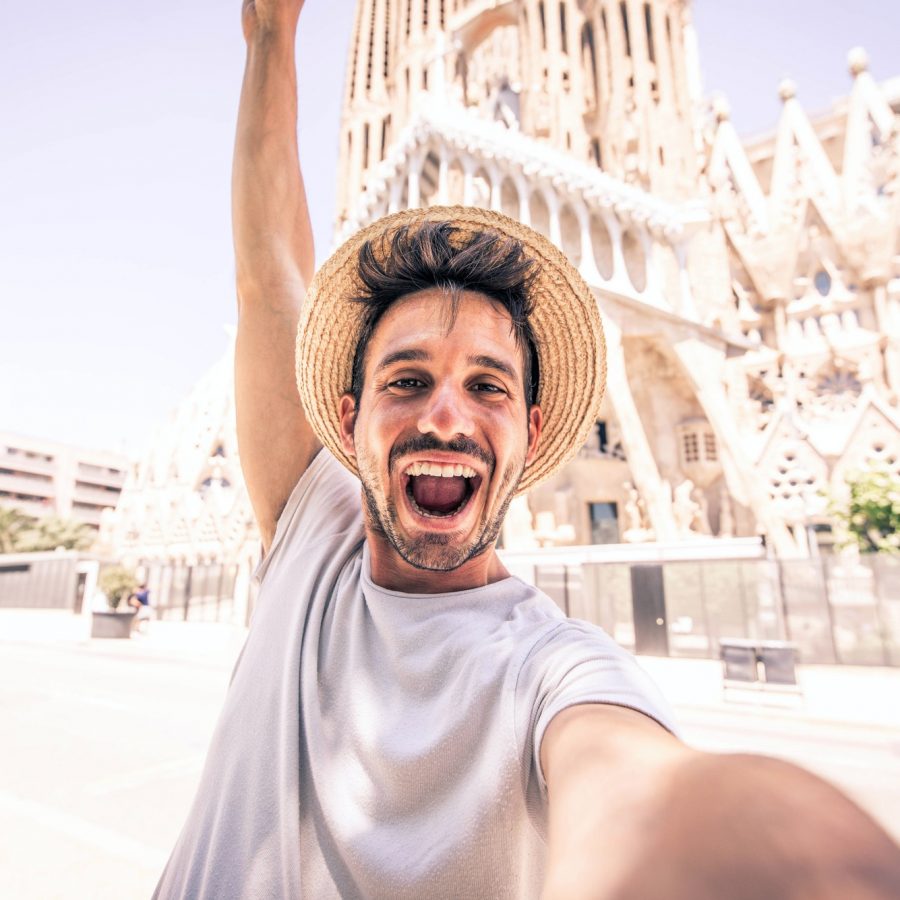 Happy tourist visiting La Sagrada Familia, Barcelona Spain
